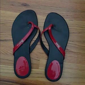 Pink and Black Gucci flip flops